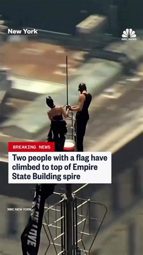 Two people were taken into police custody after climbing to the top of the Empire State Buildin