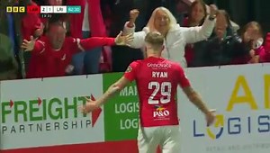 There have been wild celebrations in Larne after the town's football team became the first Irish League side to reach the group or league phase of a European club competition. Just a few minutes before full-time at Inver Park last night, Andy Ryan got the winning goal! | BBC Newsline