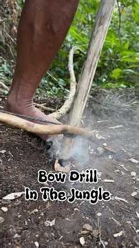 making fire in the forest with a bow drill on a tree branch #primitivefirelighting #bushcraft
