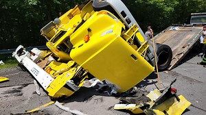 Bucket truck crashes and rolls over in New Hampshire