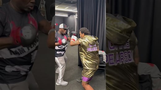 Christopher Pearson warming up with Nate Jones on pads