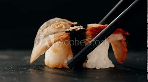 Eel fish sushi, sashimi Nigiri Platter, japanese sushi restaurant, Fresh Tuna and Salmon Slices in modern cafe, traditional food, raw red fish dish, omega 3.