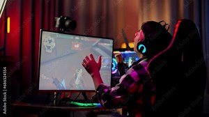 Asian Boy Streamer Having A Backache While Playing Game On Computer. Live Stream