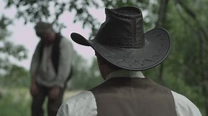 Cowboy watches lynching - Hangman