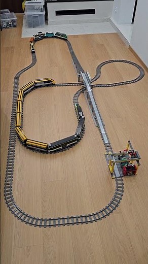 Two LEGO train routes with a long passenger consist