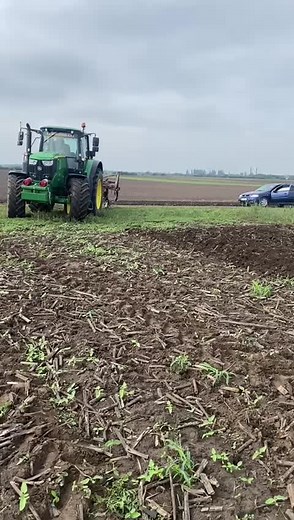 John Deere Tractor Plowing Freshly Tilled Field