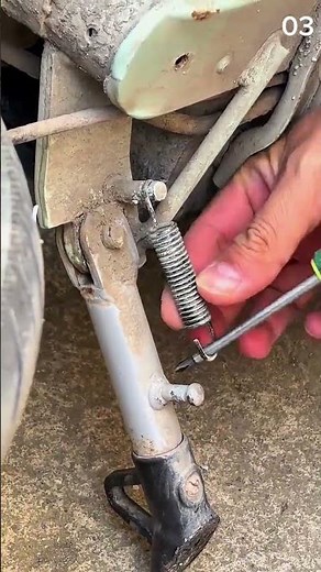 Fast and safe motorcycle side stand spring installation technique