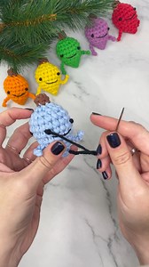 3.7K views · 48 reactions | Need a quick and foolproof way to 'embroider' eyes on your amigurumi? Try this simple knot method. P.S. You can wrap your yarn as many or few times as you need to adjust the size of the knot Grab the Crochet Lightbulb Guys Garland free pattern: https://bit.ly/4nHWd8n Shop the Bernat Maker Minis yarn: https://bit.ly/47EsY0c | Bernat Yarn | Facebook
