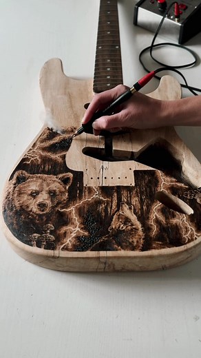 Woodburning progress on the guitar. Artwork titled ‘Electric’ ⚡️ Original pyrography on an s-style electric guitar. Guitar will be assembled and fully playable when complete. Pickups and hardware info coming soon. #pyrography #woodburning #woodart #guitar #customguitar