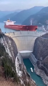 Tanker Hits the Dam… It Starts Collapsing A massive tanker somehow gets way too close and slams into the dam wall. Concrete cracks, chunks fall, and the structure starts breaking apart—everyone watching is like… how did it even get that close?! #tanker #dam #crash #ship #reels | The.worldai