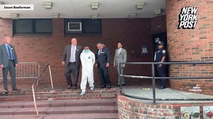 Tyrese Haspil is walked by NYPD detectives outside the 7th Precinct