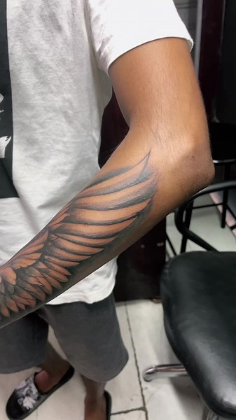 Outer Forearm Wing Tattoo Ideas for Men and Women