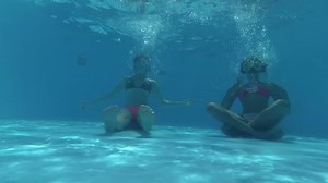 Two Girls Sitting Bottom Swimming Pool Stock Footage Video (100% Royalty-free) 32672977 | Shutterstock