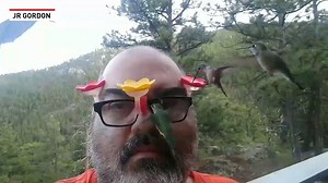This man wears his hummingbird feeders! | The National Desk - TND