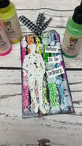 Dina Wakley Refuse to be Ordinary Tag! Watch @art_journallove create this captivating tag using @dinawakley MEdia Glosses. The juxtaposition of vibrant neon colors🎨 behind pristine white paint creates a visually alluring effect that’s simply mesmerizing. 🌟 Add this to your journal pages or tuck it in a pocket page for a delightful tactile surprise.📒💖 Supplies: 🔹Dina Wakley MEdia #8 White Tag 🔹Dina Wakley MEdia Jumbled letters collage tissue 🔹Dina Wakley MEdia Glosses 🔹Dina Wakley MEdia M