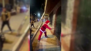 Watch the moment a cop dressed as Santa busts a drug gang