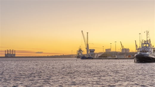 Industrial Crane working at Harbour loading ship Sunset Timelapse 4K | Premium Stock Video Footage