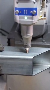professional operator is cutting iron bars using automatic laser machine