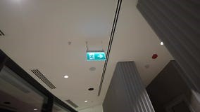 Emergency Exit Sign Guides Toward Safety in Building Stock Video - Video of direction, space: 412790649