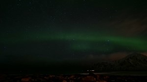 Premium stock video - Northern lights or aurora borealis over the sea in lofoten islands in norway