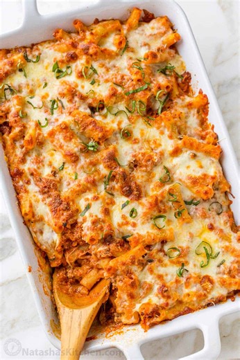 This Baked Ziti is an easy, saucy, cheesy pasta casserole with all of the great flavors of Lasagna, but so much easier! Recipe: https://natashaskitchen.com/baked-ziti/ | NatashasKitchen.com