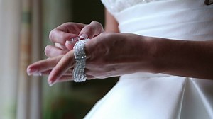 Bride puts on a diamond bracelet - Free Stock Video