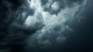 Very dramatic sky with dark ominous clouds - lightning strikes in clouds