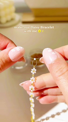how we make one of our most popular items—the Daisy Bracelet 🌼✨ made of lustrous white & gold glass seed beads, 18K gold vacuum-plated findings, and a 1.5” extension chain 💛 on our website now! #beadedbracelet #handmadejewelry #daintyjewelry #beadedjewelry #aesthetic #daisybracelet #minimalstyle #aestheticstyle
