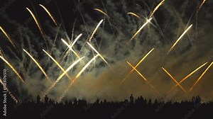 Crowd of people watch Breathtaking spectacle of international fireworks festival as vibrant colors explode against night sky. Dazzling display encompasses a wide array of shapes and patterns Stock Video