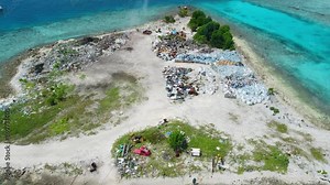 Toxic dump on island in Maldives. Aerial view of ecology problem with pollution by rubbish