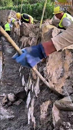 How Master Masons Build Massive Retaining Walls Using Natural Stone and Mortar!