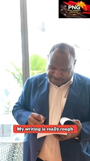 PM James Marape Gifts Special PNG Rugby League Book to Willie Mason