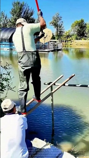 Waterproof Overalls Worker" Hammers Wood Stakes with Precision!