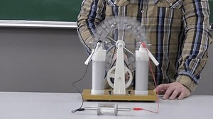 clip-3440483755-charged-metallic-spheres-dielectric-cylinder-illustrate ...