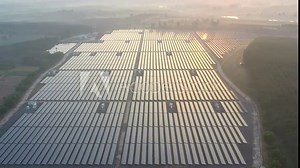 Aerial drone view looking downwards into large solar panels at a solar farm. Solar cell power plants. footage video 4k.