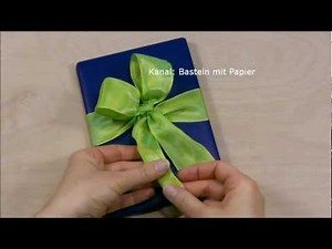 Geschenk einpacken mit Schleife. Geschenk leicht verpacken. Geschenkschleife binden mit Geschenkband