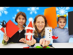 Nicole, Zara ve Defne, renkli kâğıtlardan kardan adam ve Noel Baba yapıyorlar! Çocuk videoları.