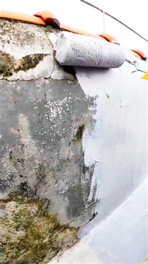 Fresh paint brightens cracked concrete wall