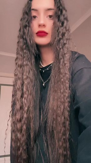 Expressive Hand Movements in a Stylish Black Outfit