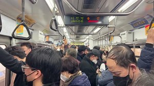Inside the crowded subway on the way to work in Seoul, Korea