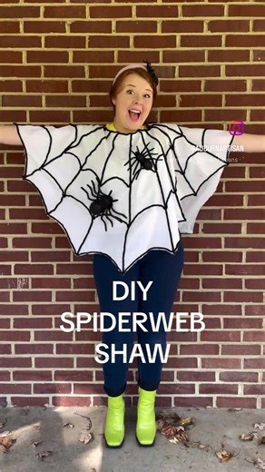 DIY SPIDERWEB SHAW What you’ll need: - White Sheet - Thick Black Yarn - Spiders (I got mine from the dollar store!) - Fabric Glue - Scissors How To: 1.) Fold sheet in half 2.) cut out neck hole in the center of the fold, making sure it cuts through on both sides 3.) sketch out the spider web shape and cut it out of the sheet 4.) Glue the yarn on the sheet- first from the arches along the perimeter of the spider web up to meet together in the center/neck hole. And then connect the lines by gluing