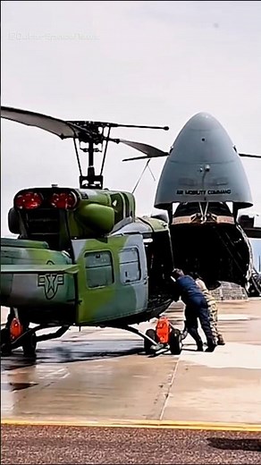 UH-1 Iroquois loading into C-5M