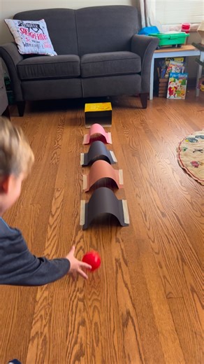 Brittany | Kids/Toddler/Baby Activities on Instagram: "Looking for a quick and easy activity? Build tunnels with paper and try to roll a ball through them into a cardboard box. Quick, easy, fun! Inspired by: @wandernplay"