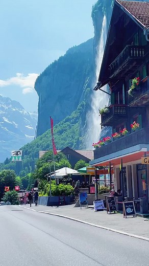 Tranquil Waterfall Views in a Charming Swiss Alpine Village