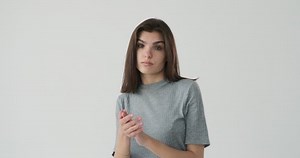 Bored woman clapping her hands