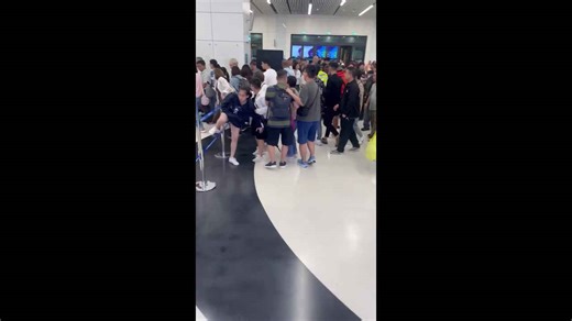 Passengers surge through airport as flights resume in Macau following typhoon