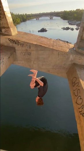 Daring Bridge Jump into River at Sunset