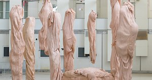bart hess manipulates pink latex to resemble wrinkled human skin in grotto installation