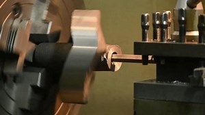 clip-3624452895-slow-motion-scene-cnc-lathe-machine-boring