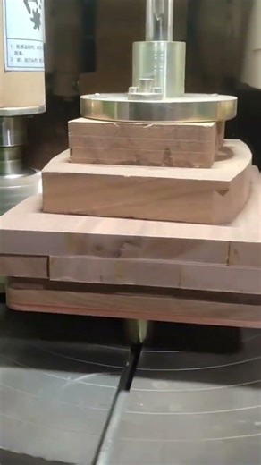 spindle moulder machine trimming edges of stacked wooden planks with high speed rotating cutter